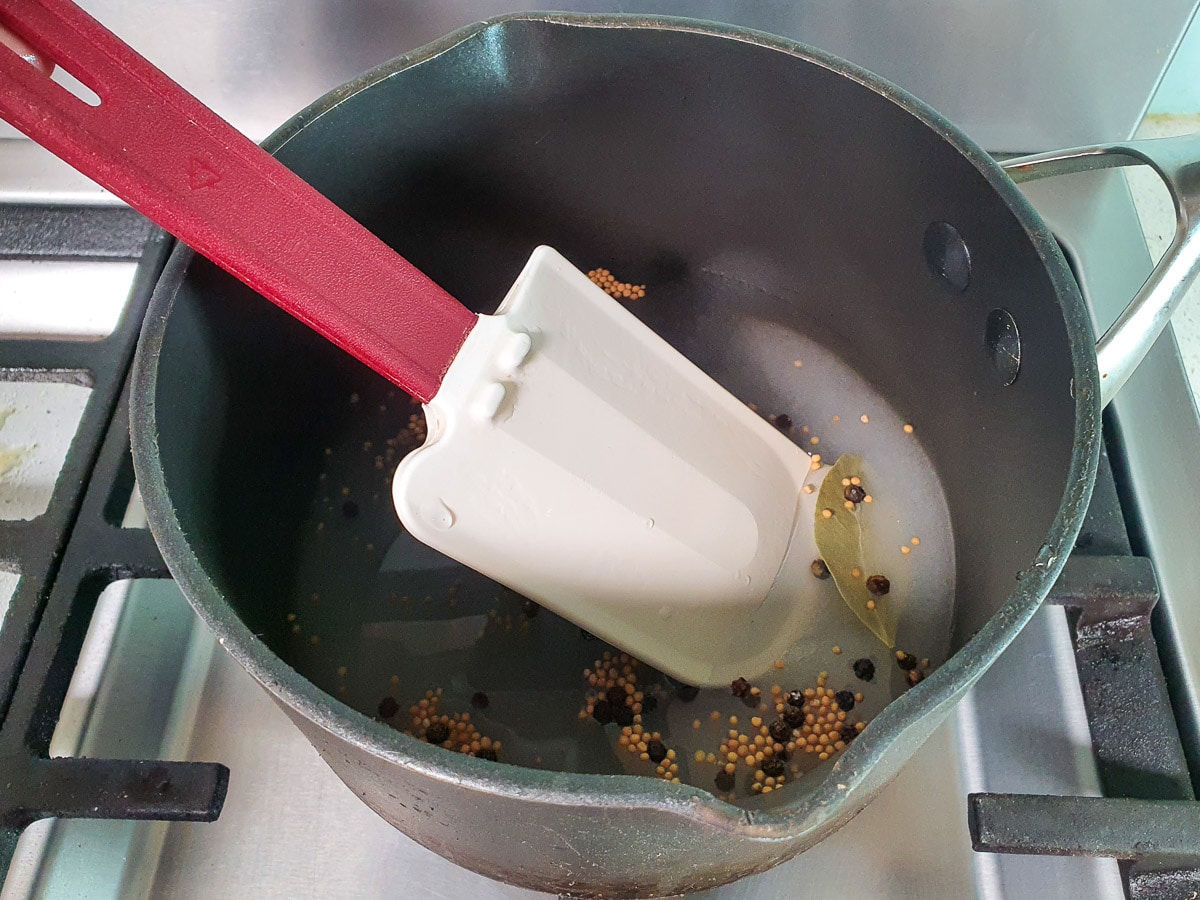 Refrigerator pickled beets 8 Stirring pickling liquid in pot on stove to dissolve sugar and salt.