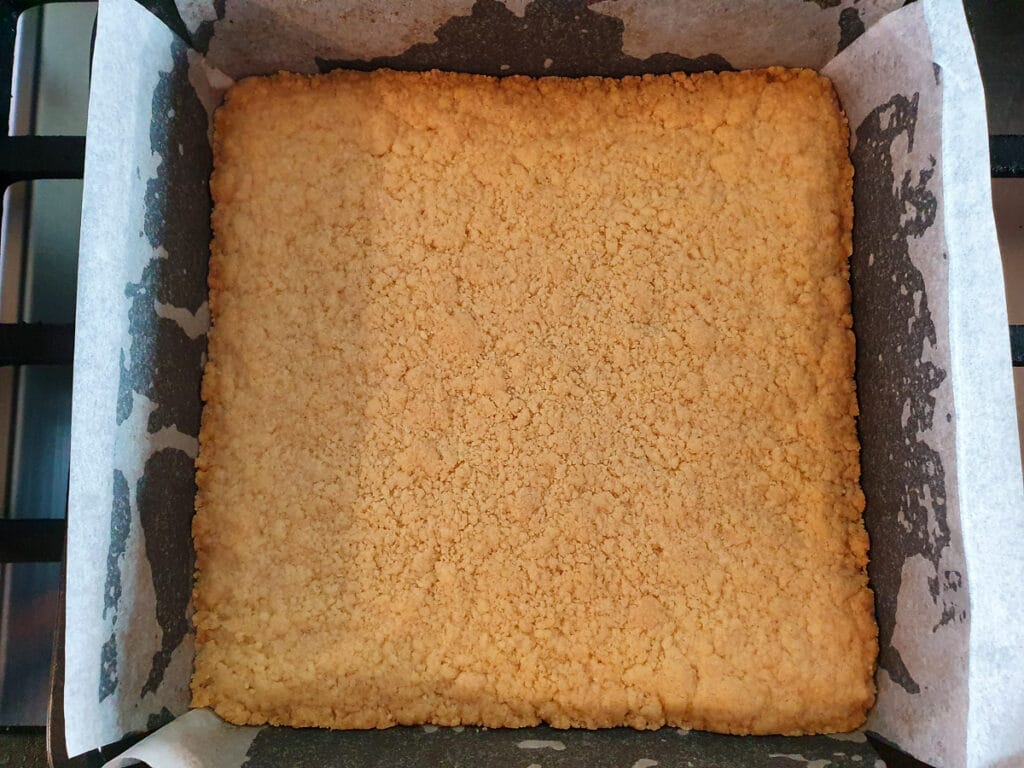Cooked base ready to remove from oven, just starting to brown around the edges.