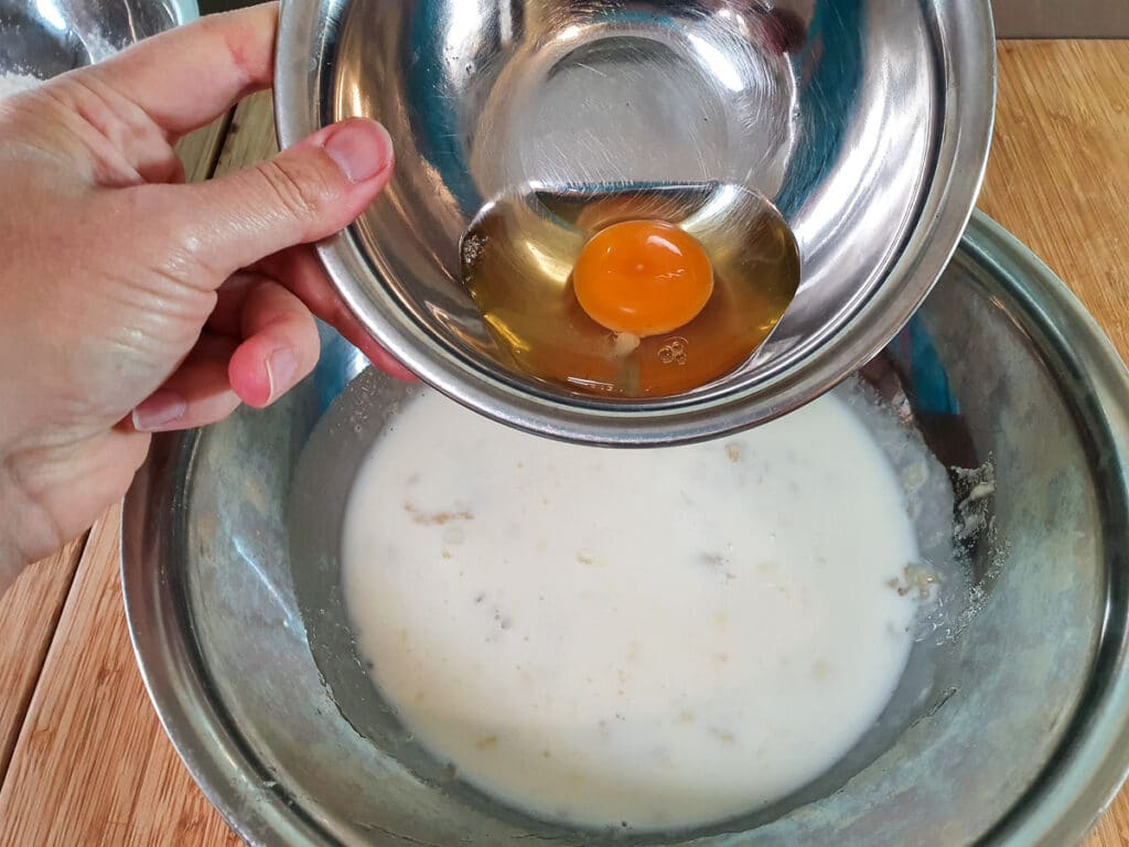 Banana pikelets 9 Adding egg to milk and mashed banana