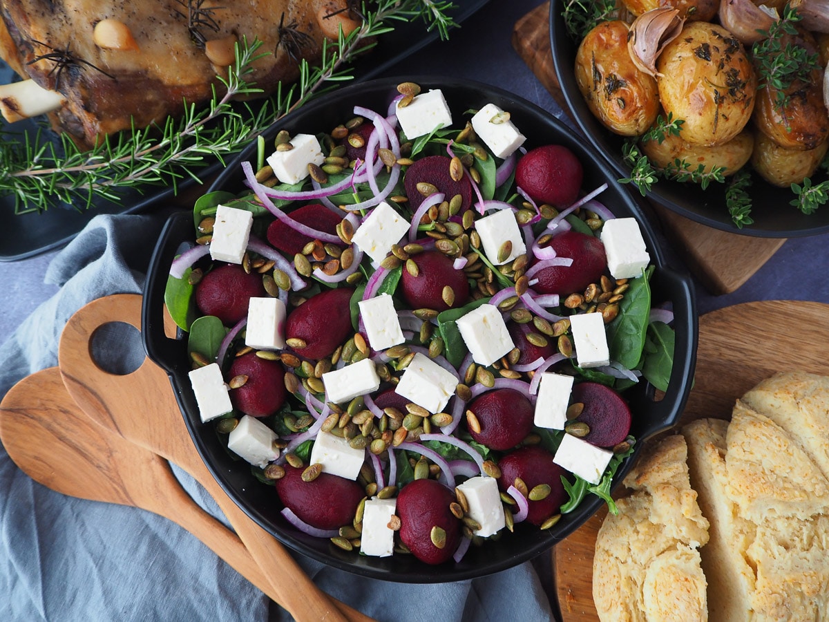Beetroot salad 1 Beetroot salad on a plate, with damper and roasted mini potatoes on the side.