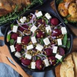 Beetroot salad 15 Close up beetroot salad on a plate, with damper and roasted mini potatoes on the side.