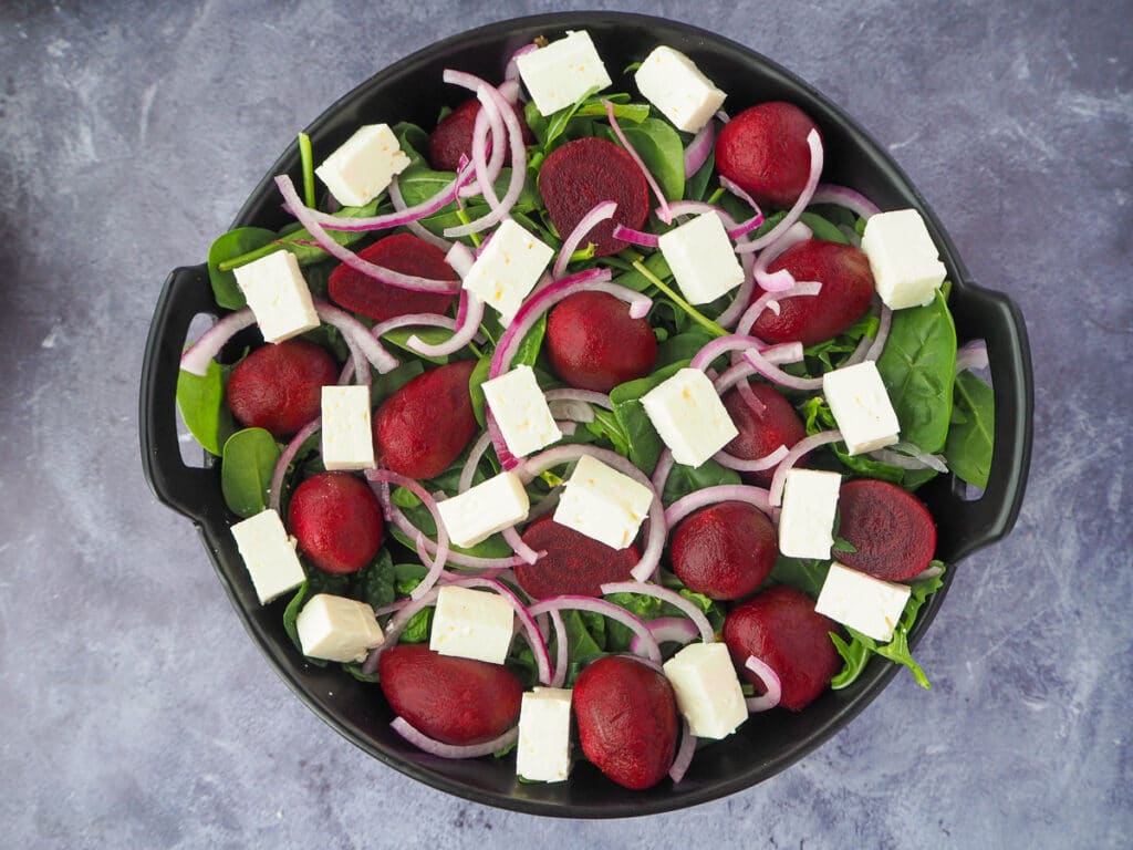 Beetroot salad 11 Adding finely sliced cubed fetta cheese to the salad.