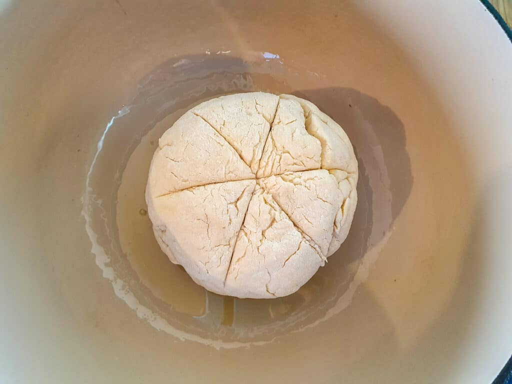 Dough in greased Dutch oven ready to bake.