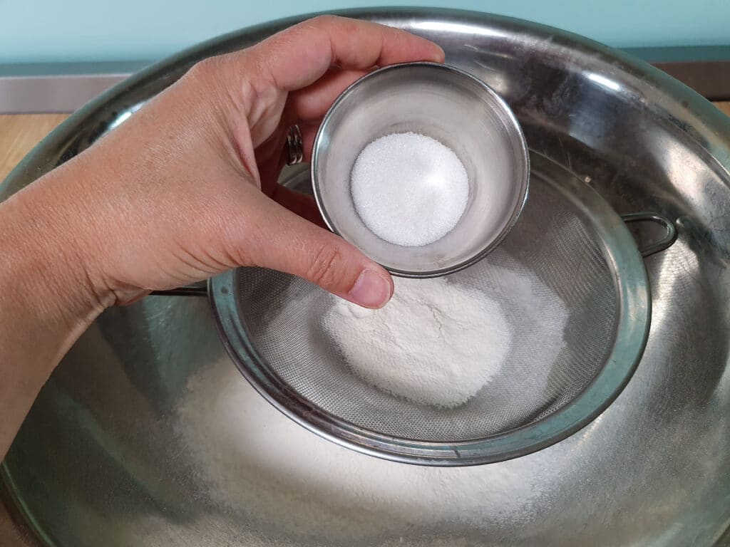 Pikelets 5 Sifting sugar.