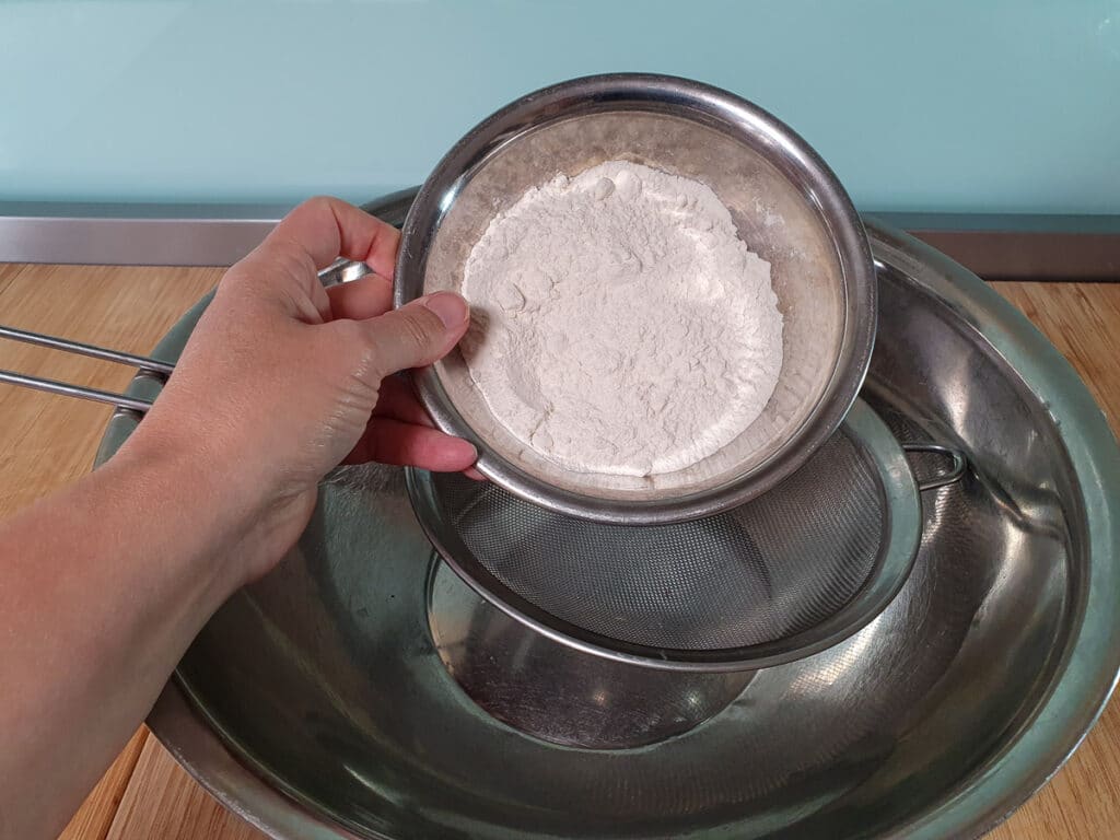 Pikelets 4 Sifting flour.