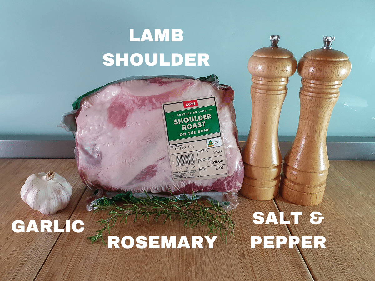 Slow cooker lamb shoulder ingredients, lamb shoulder roast, garlic, fresh rosemary sprigs, freshly ground salt and pepper.
