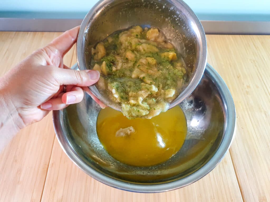 Adding feijoa pulp to rest of wet ingredients.