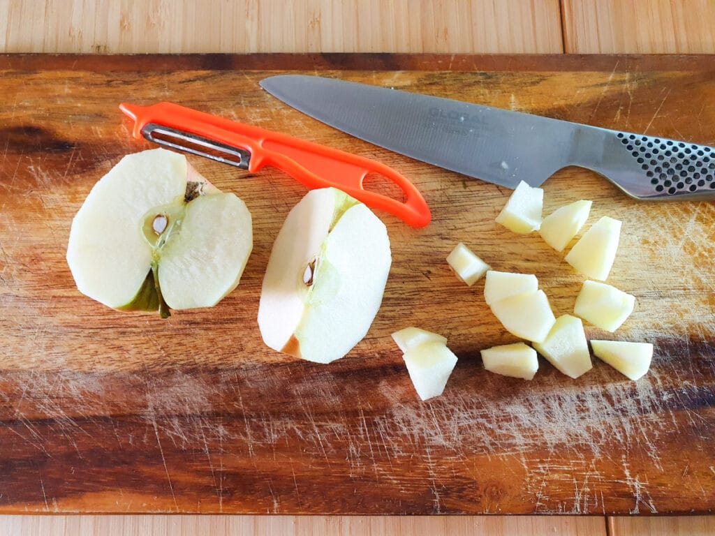 Feijoa chutney 5 Peeling, coring and slicing apples into cubes.