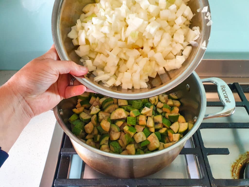 Feijoa chutney 8 Adding diced apples and onions to pot.