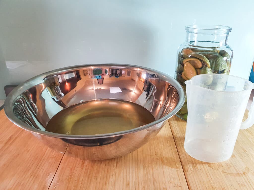 Large bowl of strained fizz after initial brew, ready to add extra sugar and yeast to.
