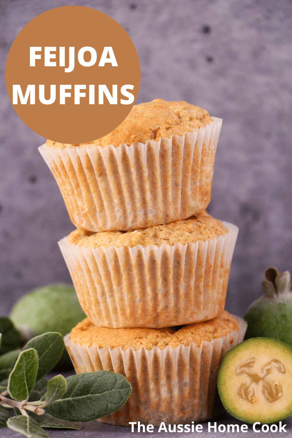Stack of three feijoa muffins, with fresh feijoas and feijoa leaves and text overlay, feijoa muffins, the aussie home cook.