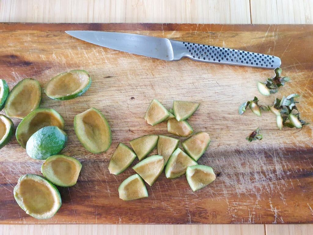 Slicing up feijoa skins.