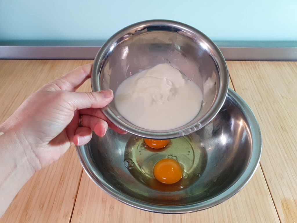 Pear muffins 7 Adding milk and yogurt to eggs.