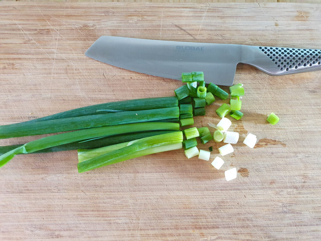 Cutting up spring onions.