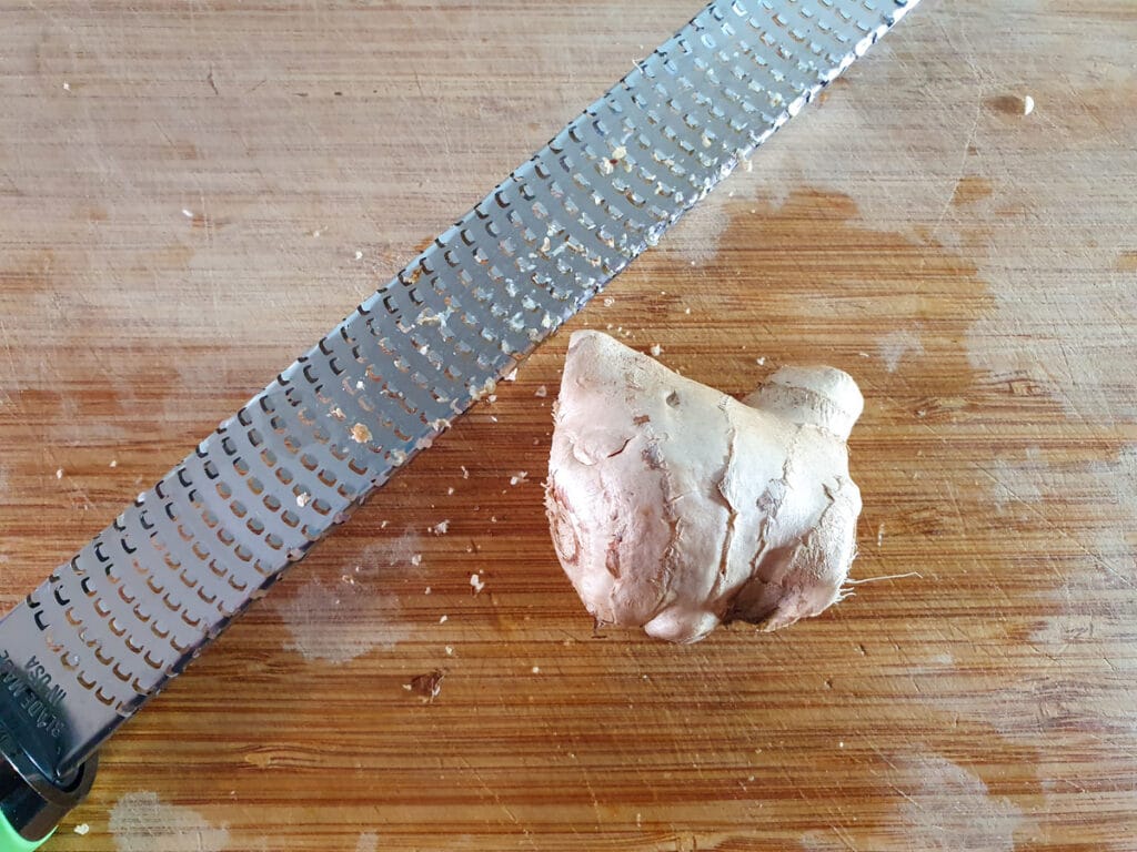 Grating the ginger.
