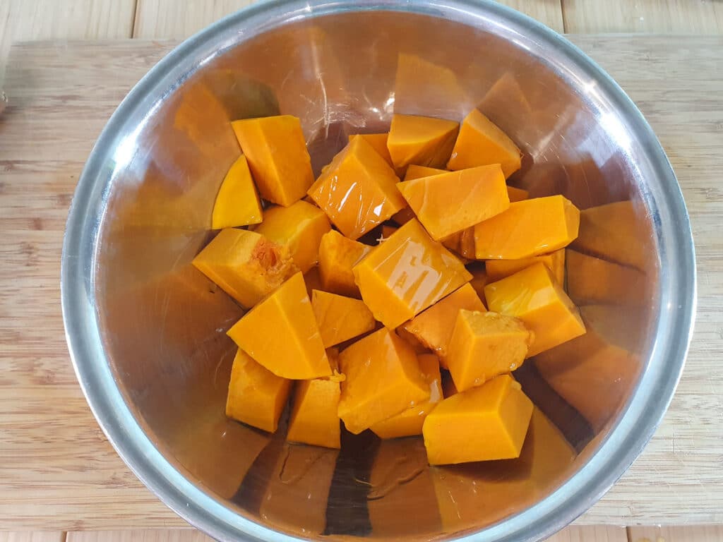 Pumpkin and Sweet Potato Soup 4 Coating the pumpkin chunks in olive oil.