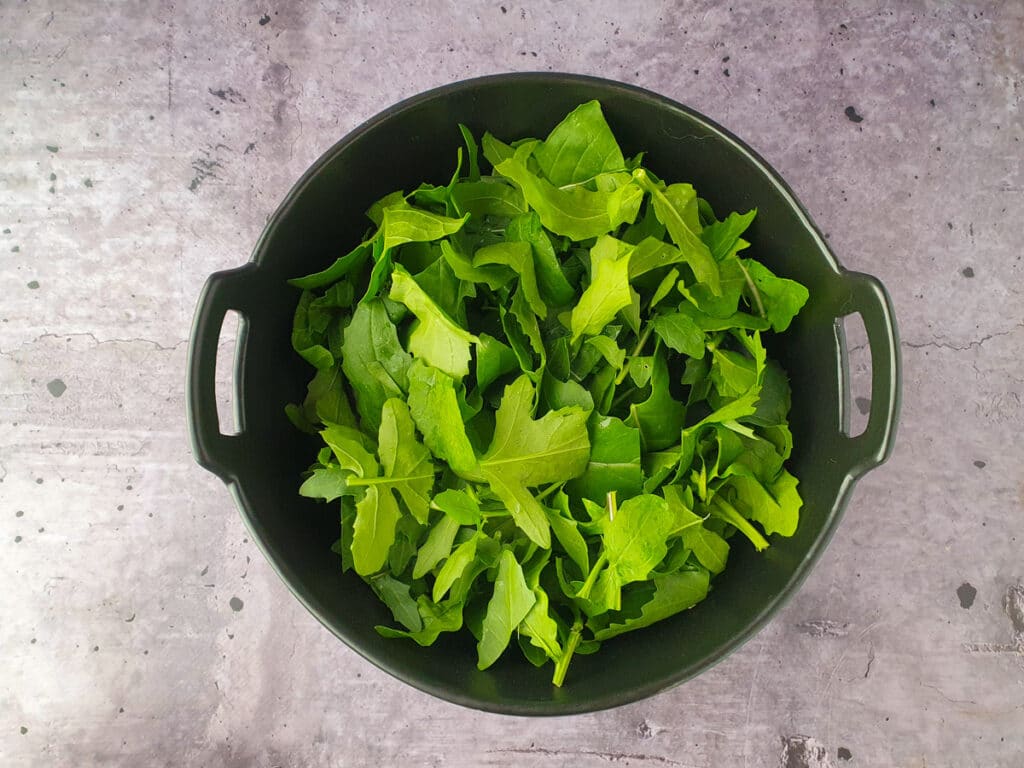 Building salad, adding rocket.