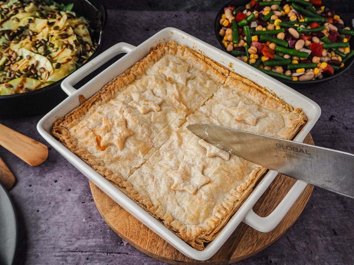Slicing pie to serve.