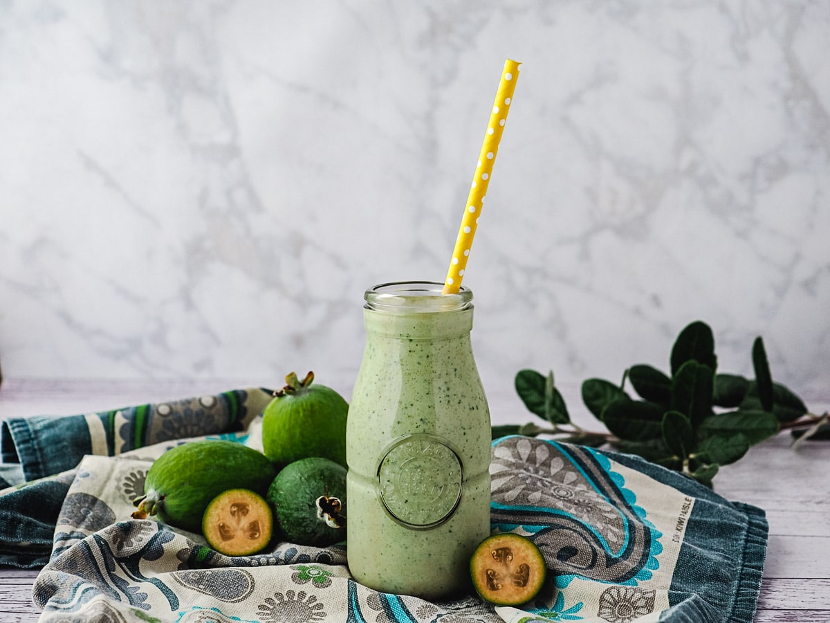 Feijoa Smoothie 1 Feijoa smoothie with straw.