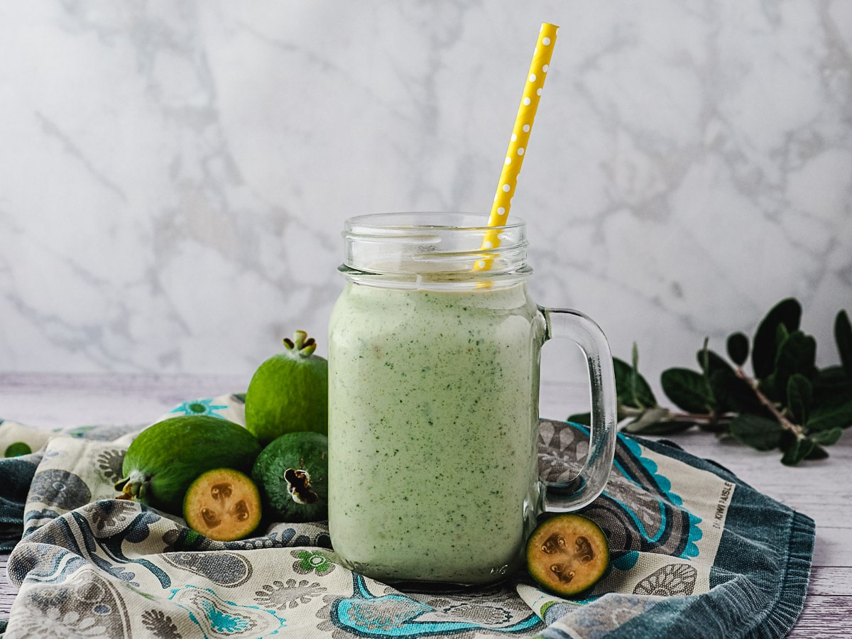 Feijoa Smoothie 7 Feijoa smoothie with straw.