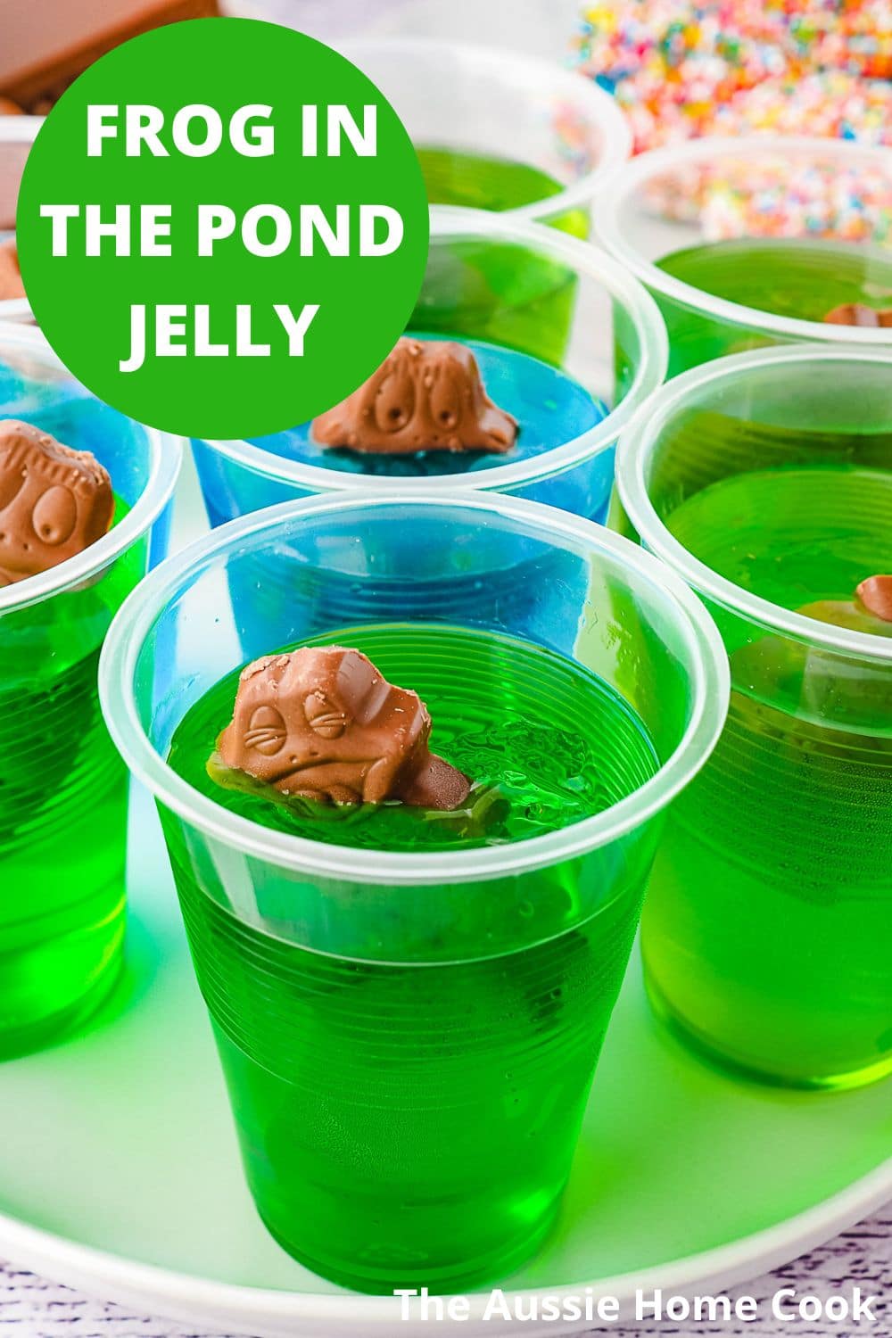 Several jelly cups on a plate.