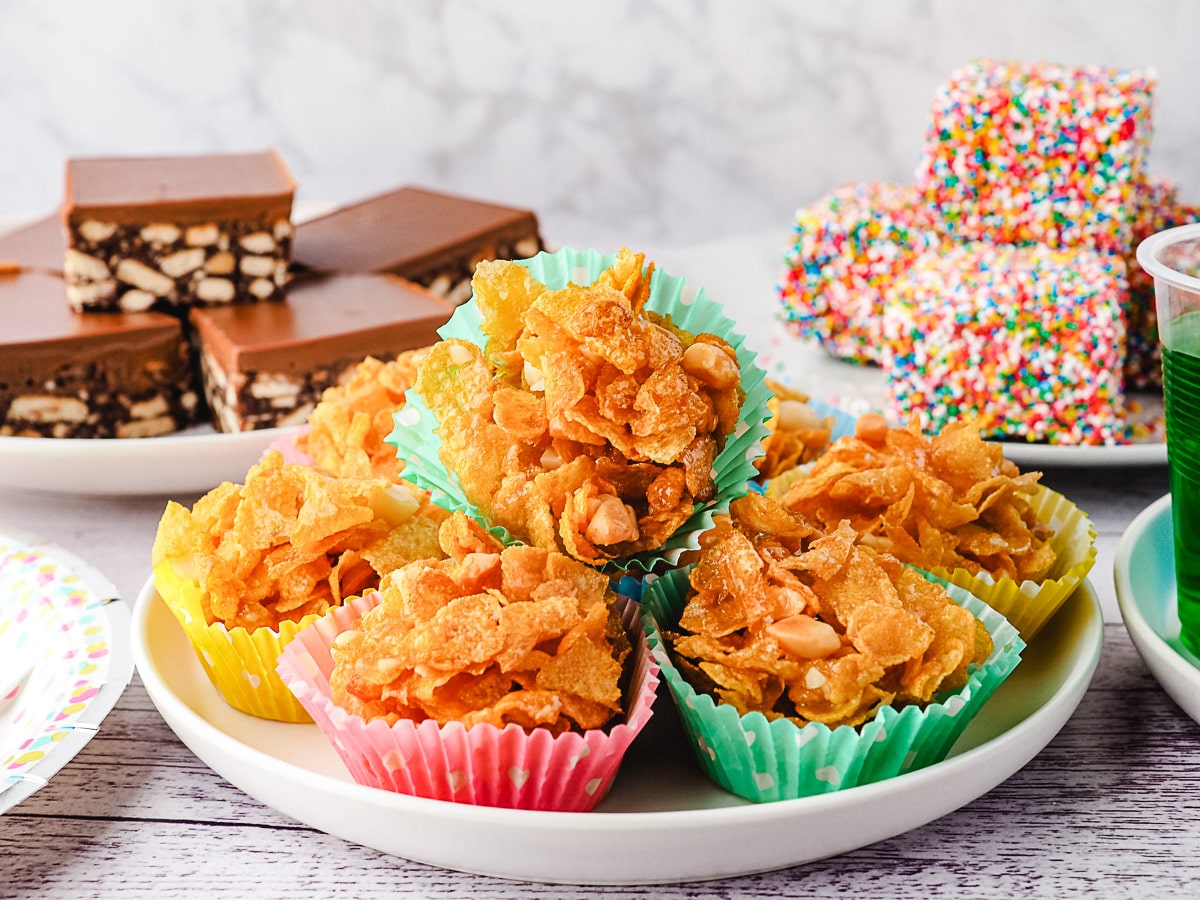 A plate of honey joys with other party food.