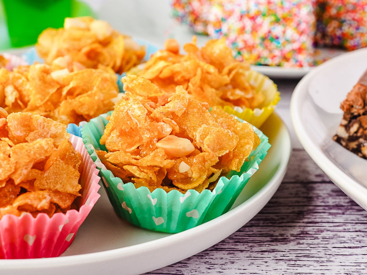 Serving honey joys on a plate at a party.