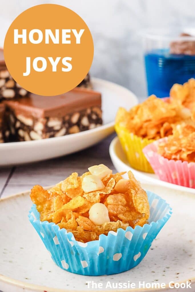 Honey joy on a plate with party food in the background.