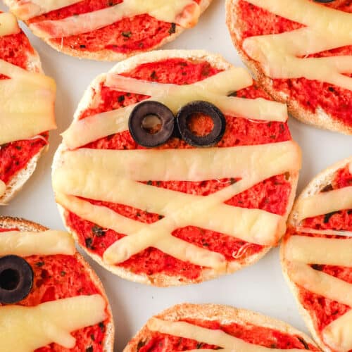 Mummy Pizzas 11 Top down view of mummy pizzas on a plate.